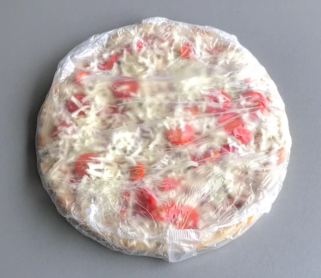  frozen pizza in a plastic bag