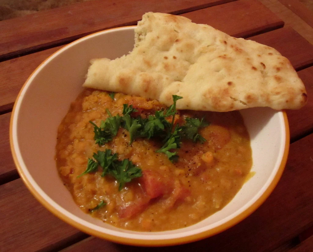 dahl with a piece of naan on top