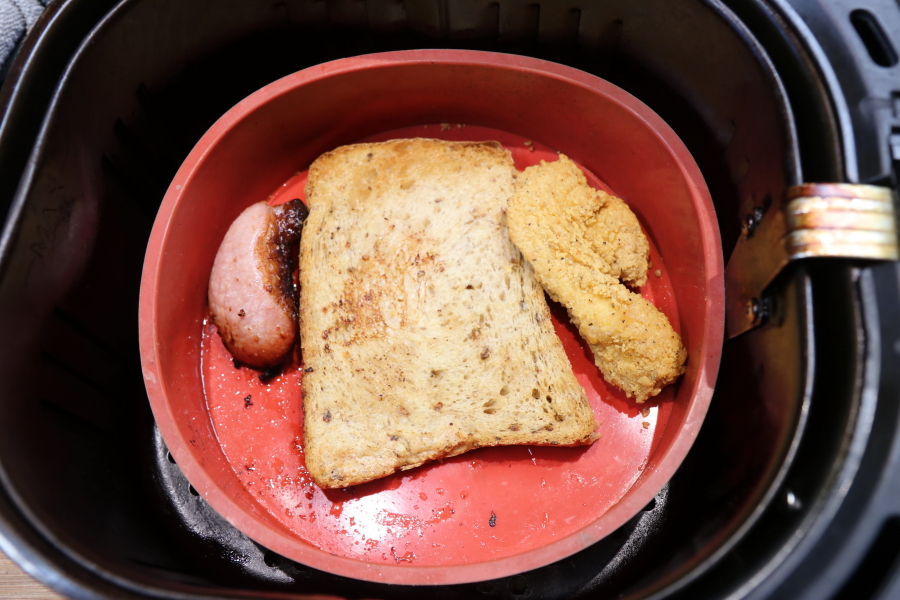 Food placed in a silicone bowl inside an air fryer