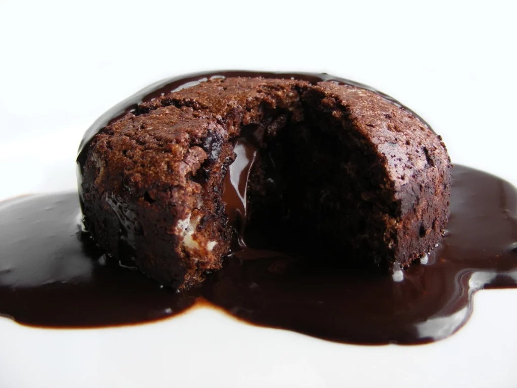lava cake soaked in chocolate sauce