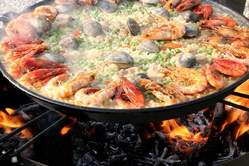 steaming seafood boil in a pan with multiple vegetables