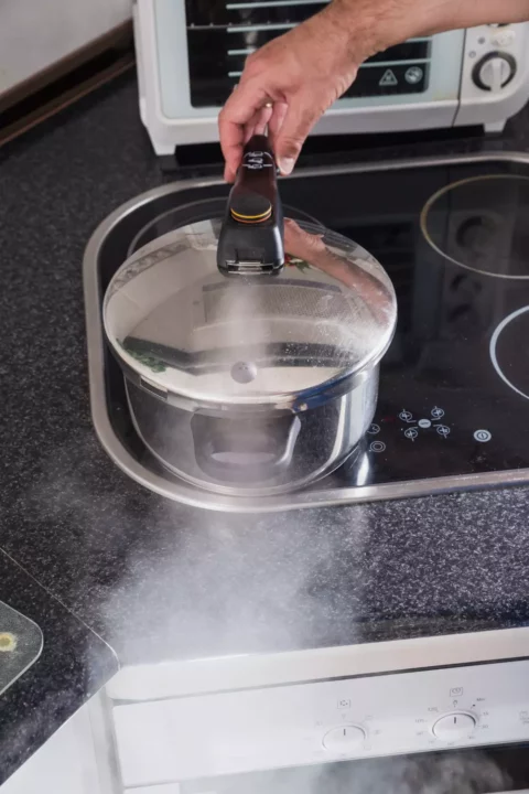 pressure cooker letting out steam